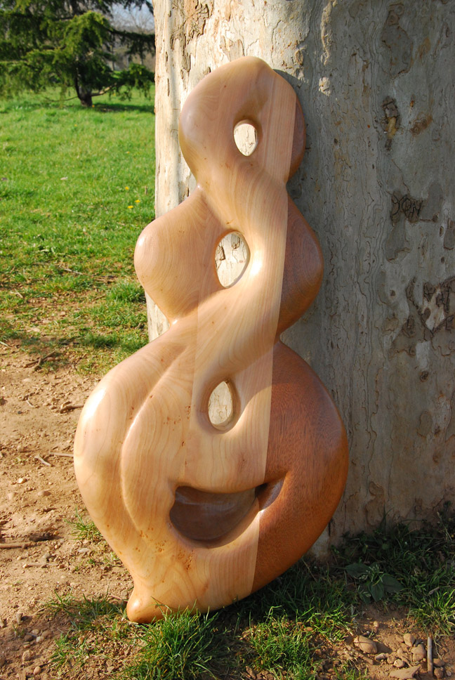  Didgeridoo nommé Koru, en Do, en forme de double huit (Koru néozélandais), fabriqué en bois de merisier et sipo 